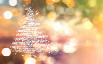 Christmas tree of stars on a bokeh lights background